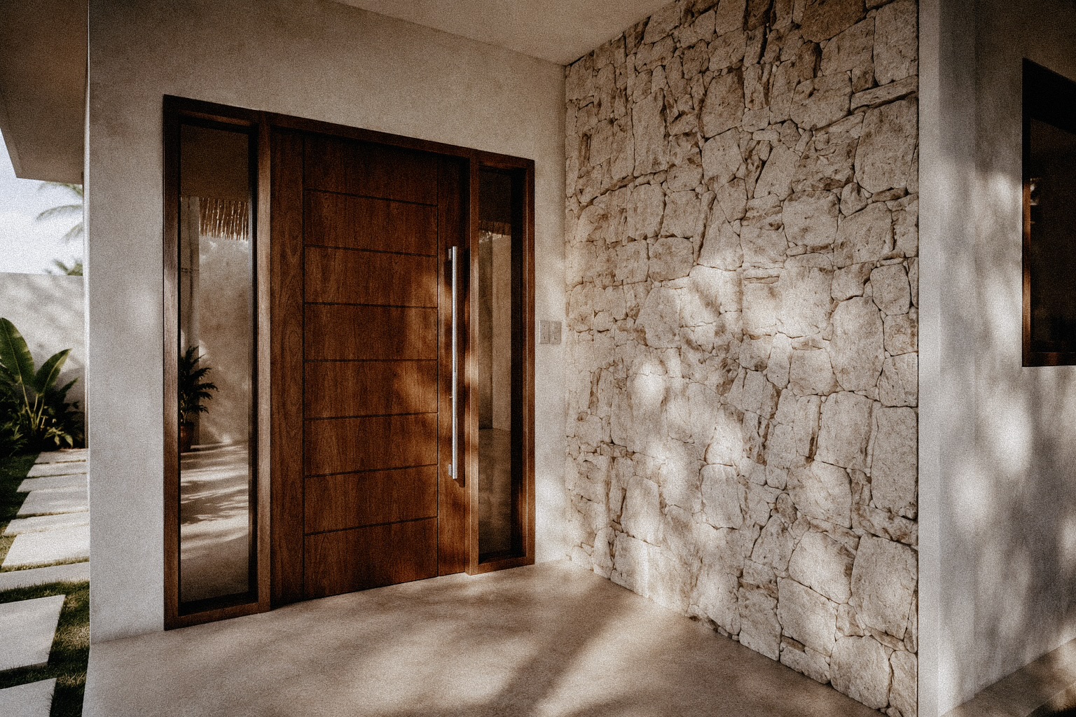 Wooden front door beside a rustic white stone wall